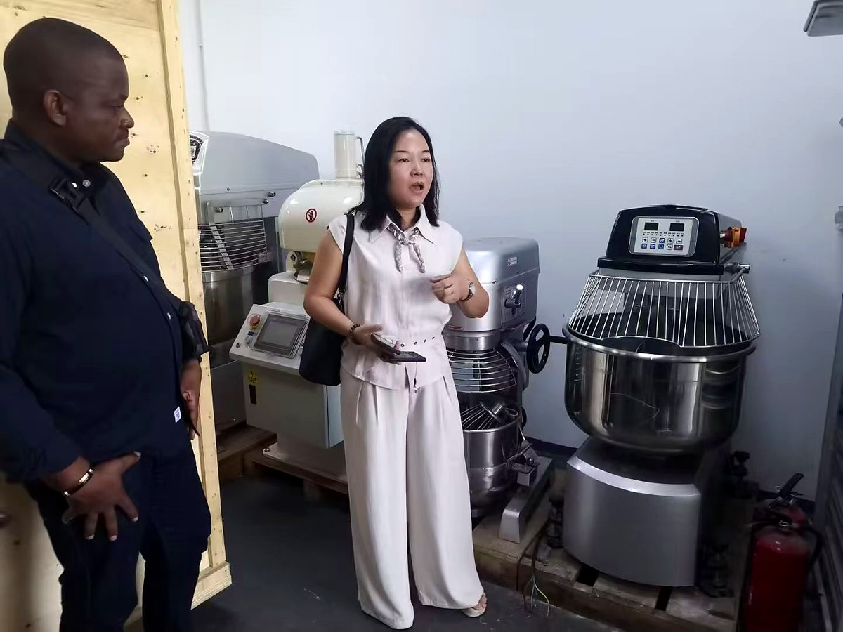 Client Inspecting Bakery Equipment